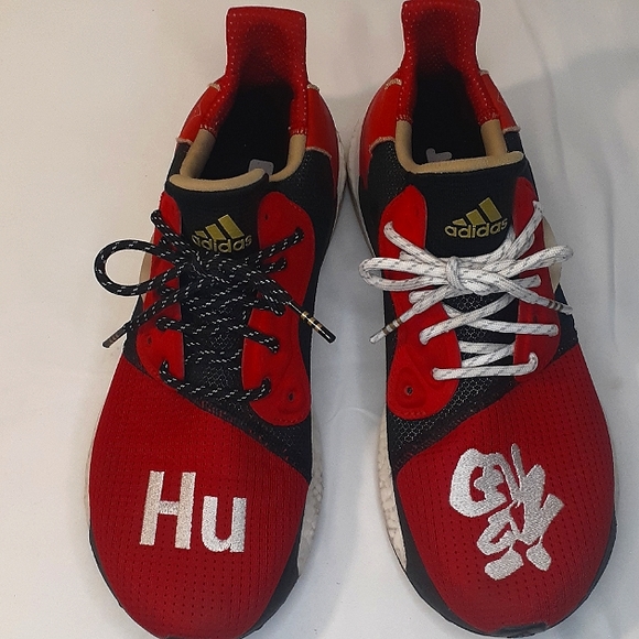 Adidas Men s Boost Solar Hu Glide ST x Pharrell Williams Chinese New Year Shoe. Shoes Shoes